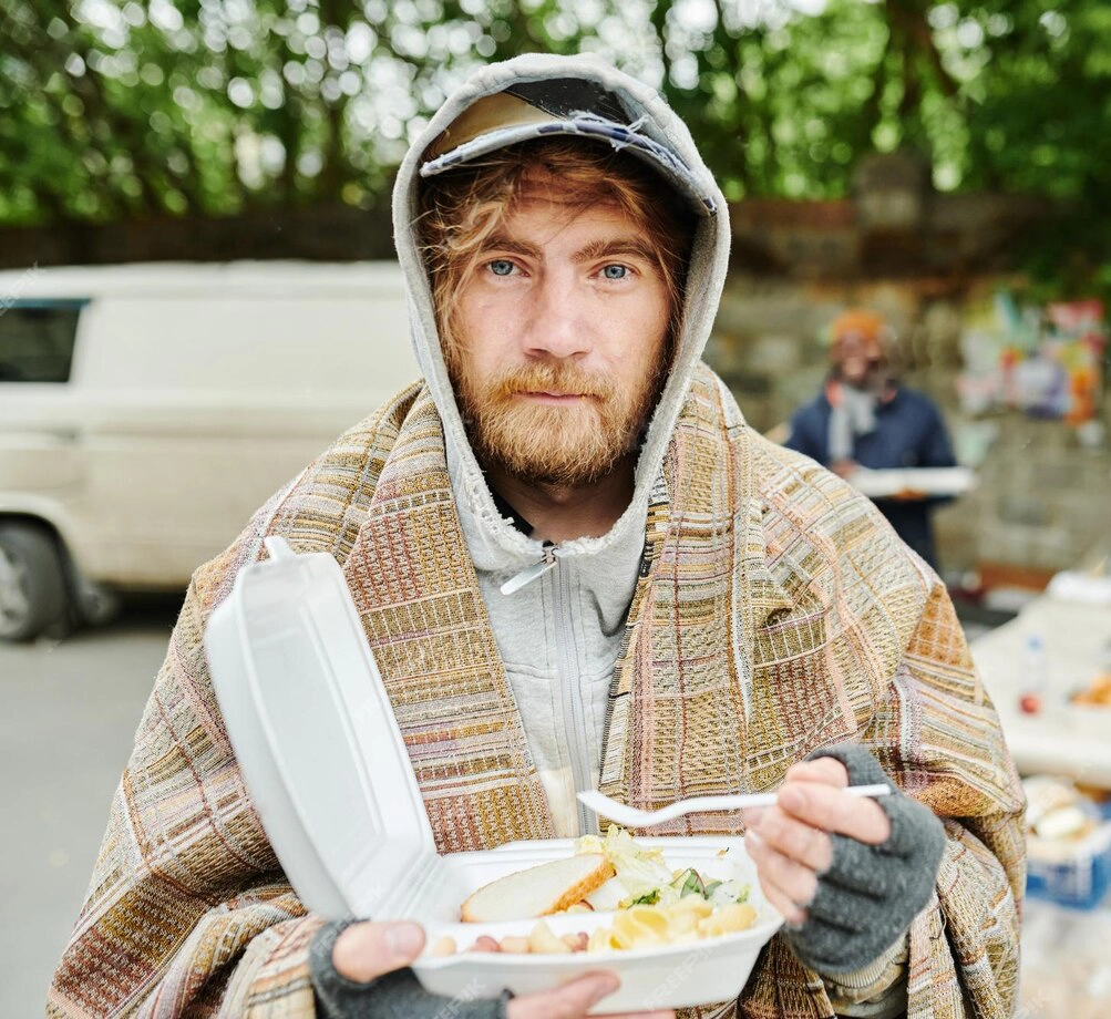 homeless-man-eating-food-outdoors