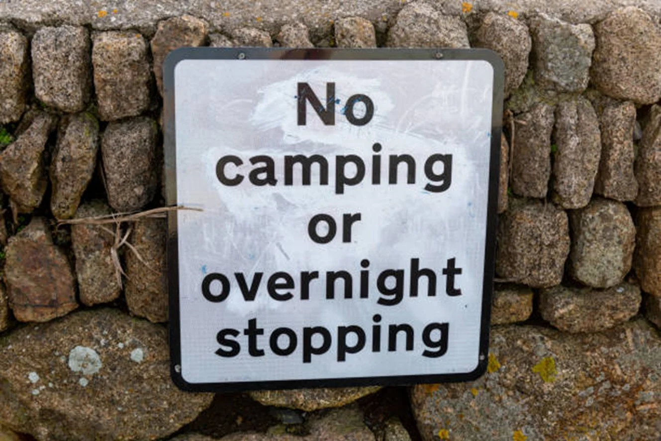 Sign stating no camping or over night stopping