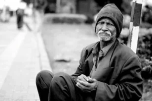 black and white photo of a homeless man